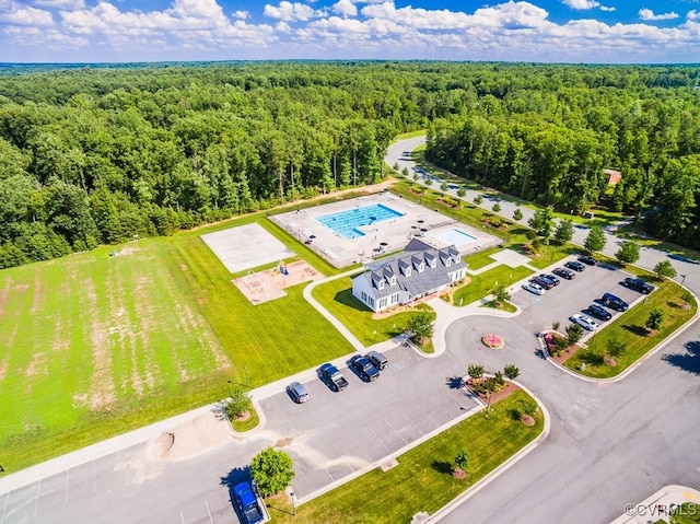 birds eye view of property with a wooded view