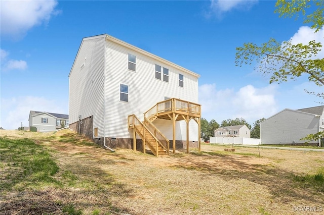 back of house featuring fence, crawl space, stairs, and a deck