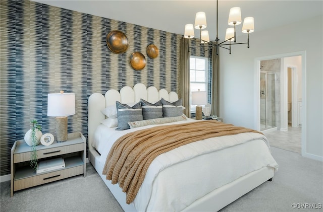 carpeted bedroom with ensuite bathroom and a chandelier