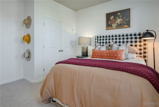 carpeted bedroom featuring a closet