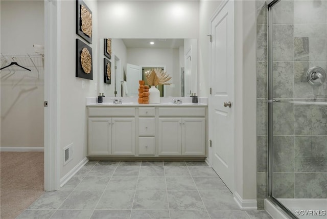 15436 Greenhart Dr, Chesterfield, VA 23832 - full bath with a stall shower, double vanity, a walk in closet, tile patterned floors, and baseboards