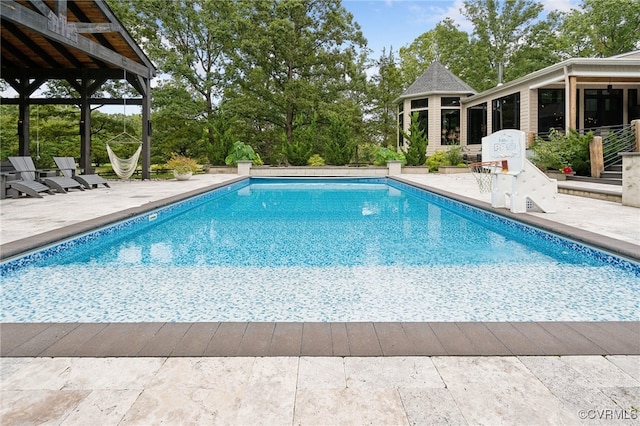 view of swimming pool with a patio