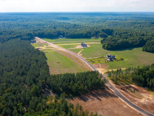 birds eye view of property featuring a rural view