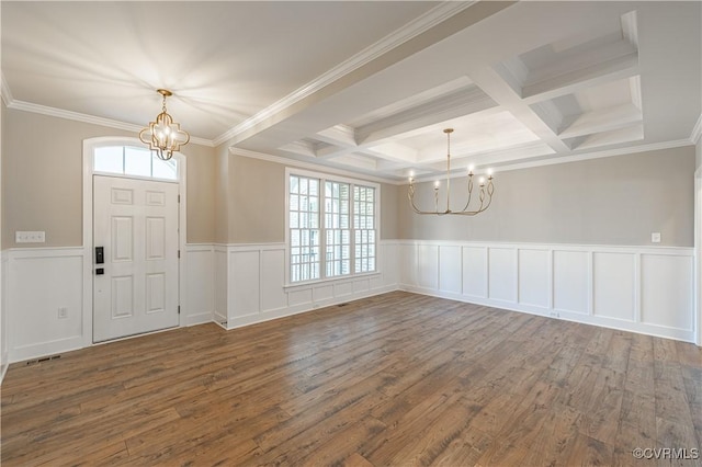 entryway featuring crown molding, an inviting chandelier, beam ceiling, coffered ceiling, and dark hardwood / wood-style flooring