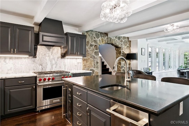4048 Broad Street Rd, Gum Spring, VA 23065 - kitchen with luxury stove, a sink, beam ceiling, a chandelier, and dark wood-type flooring