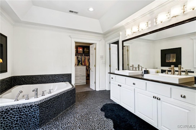 4048 Broad Street Rd, Gum Spring, VA 23065 - full bathroom with double vanity, a bath, a walk in closet, recessed lighting, and a raised ceiling