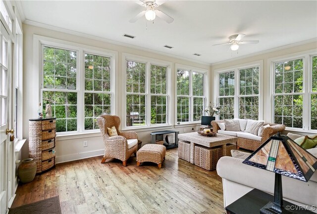 4048 Broad Street Rd, Gum Spring, VA 23065 - sunroom with ornamental molding, a wooden deck, wood finished floors, baseboards, and french doors
