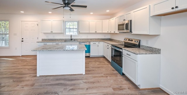 246 American Dr, Ruther Glen, VA 22546 - kitchen featuring stainless steel appliances, healthy amount of natural light, white cabinets, and recessed lighting