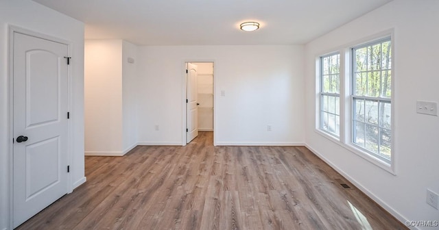 246 American Dr, Ruther Glen, VA 22546 - empty room with wood finished floors and baseboards