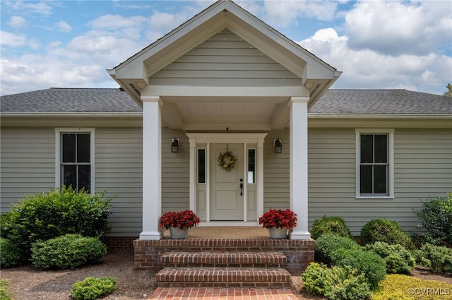 doorway to property featuring covered porch