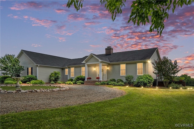 view of front of home with a yard