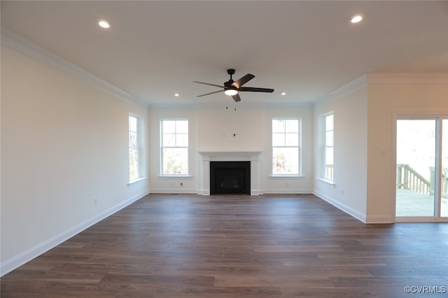 unfurnished living room featuring crown molding, dark hardwood / wood-style floors, and ceiling fan