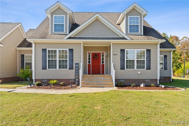 cape cod-style house featuring a front lawn