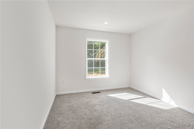 unfurnished room featuring carpet floors