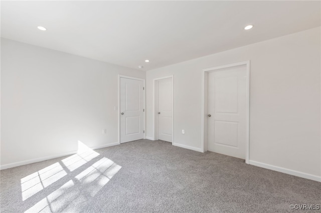 empty room with light colored carpet