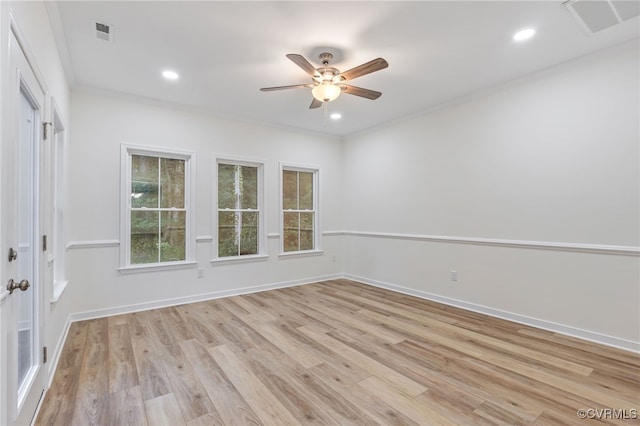 empty room with light hardwood / wood-style flooring, ceiling fan, and ornamental molding