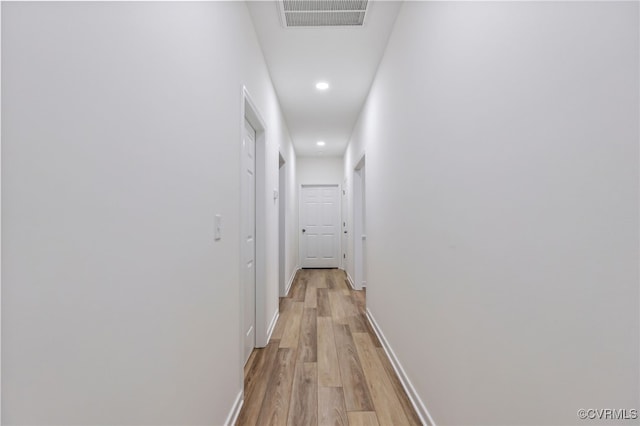 hallway with light wood-type flooring