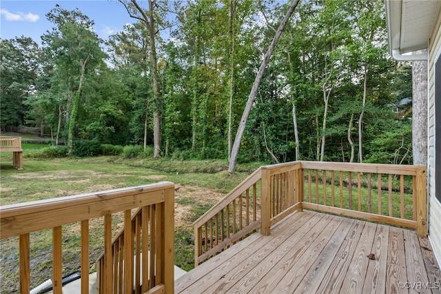 wooden terrace with a yard