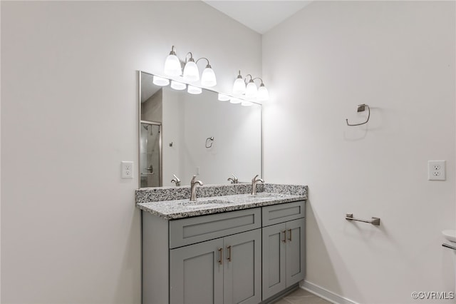 bathroom featuring vanity and a shower