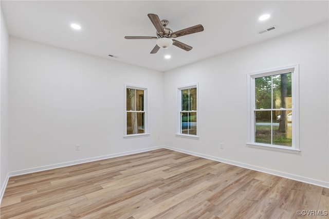 unfurnished room featuring ceiling fan and light hardwood / wood-style flooring