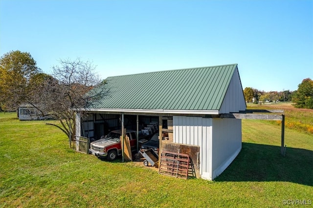 view of outdoor structure featuring a lawn