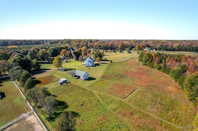 birds eye view of property with a rural view