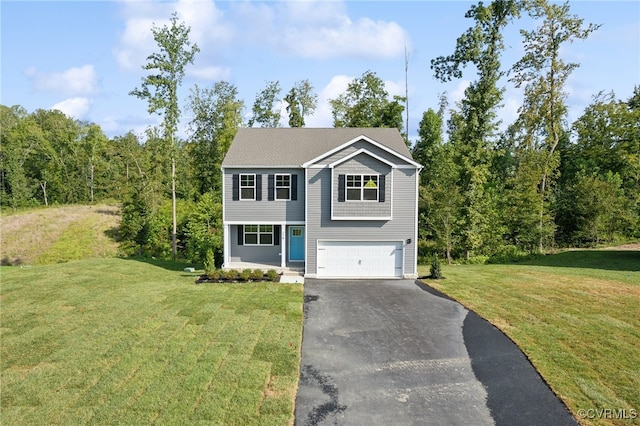 view of front of property with a garage and a front lawn