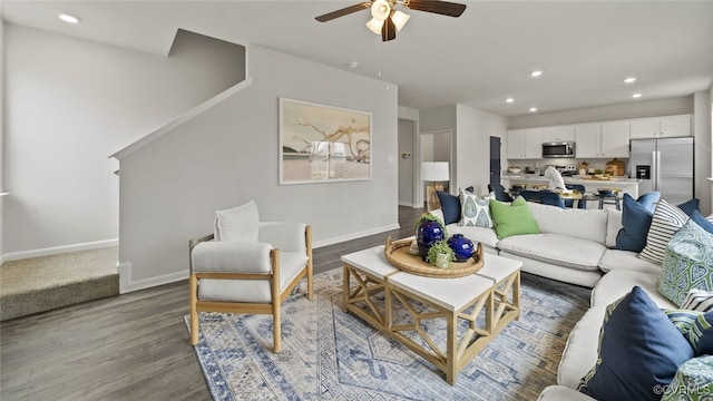 living room with light hardwood / wood-style floors and ceiling fan