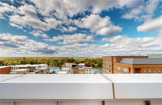 balcony featuring a water view