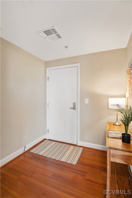 entrance foyer with hardwood / wood-style floors