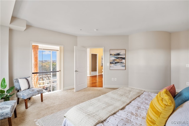 bedroom featuring light carpet