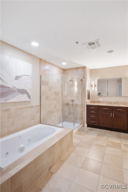 bathroom featuring tile patterned floors, vanity, and plus walk in shower