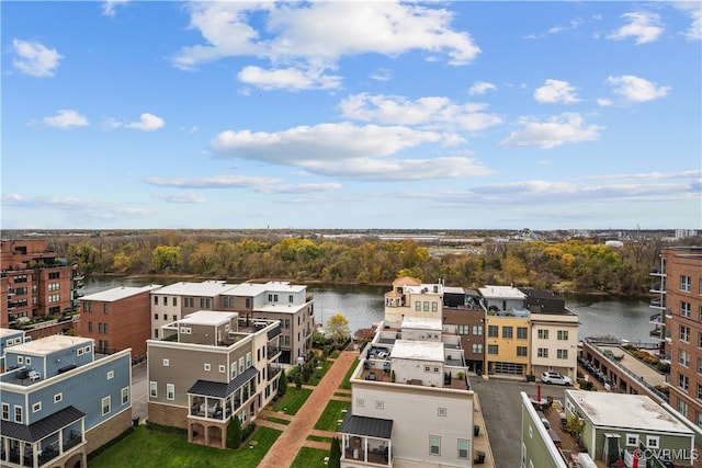 birds eye view of property with a water view