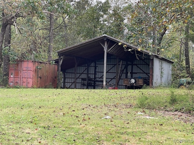 view of outbuilding with a lawn