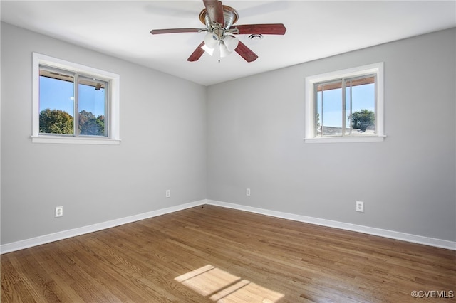 unfurnished room featuring ceiling fan and hardwood / wood-style floors