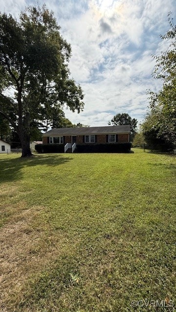 view of front of property with a front lawn