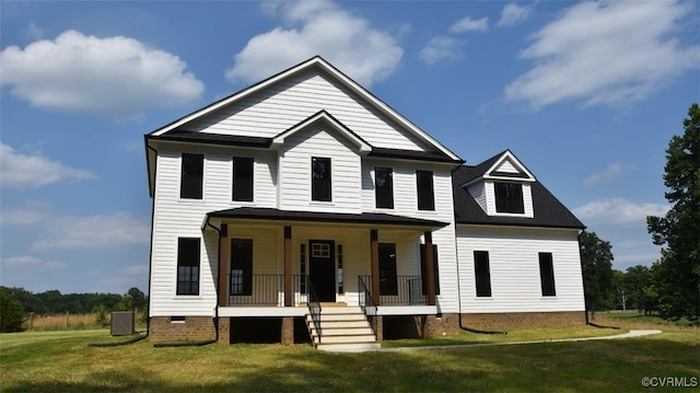 view of front of house with a front yard and a porch