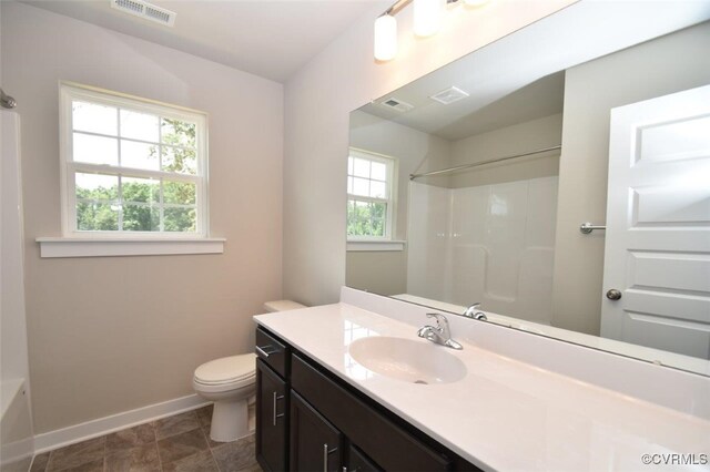 full bathroom featuring vanity, toilet, and bathtub / shower combination