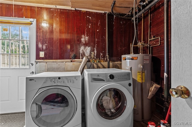 laundry room featuring washer and dryer and water heater