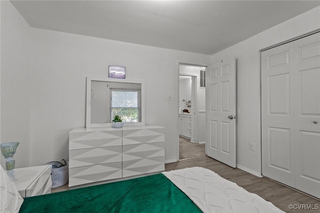 bedroom featuring hardwood / wood-style flooring and a closet