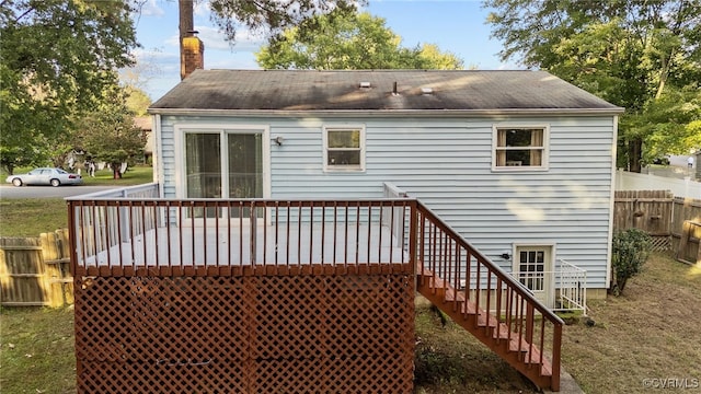 rear view of property with a wooden deck