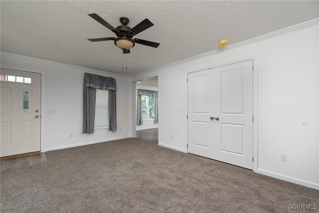 751 Jones St, Petersburg, VA 23803 - unfurnished living room featuring ornamental molding, ceiling fan, dark colored carpet, and a textured ceiling