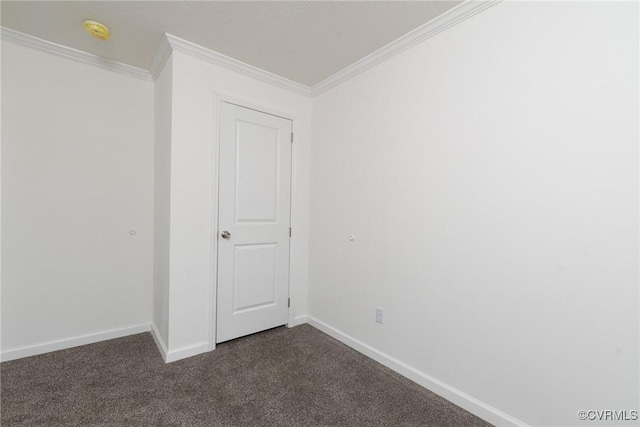 751 Jones St, Petersburg, VA 23803 - spare room with crown molding, dark carpet, and a smoke detector