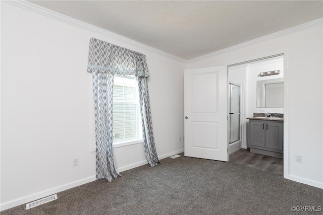 751 Jones St, Petersburg, VA 23803 - unfurnished bedroom with dark carpet, crown molding, and ensuite bathroom