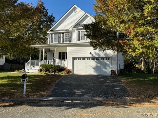 view of front of house featuring a garage and covered porch