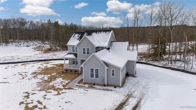 view of snow covered house