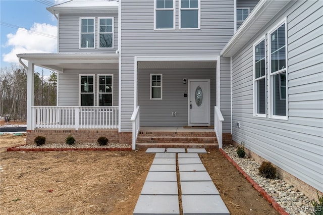 entrance to property with a porch