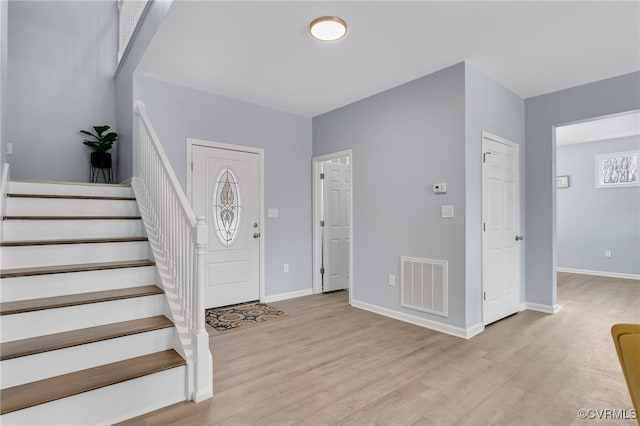 foyer entrance with light wood-type flooring