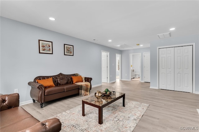 living room with light hardwood / wood-style floors