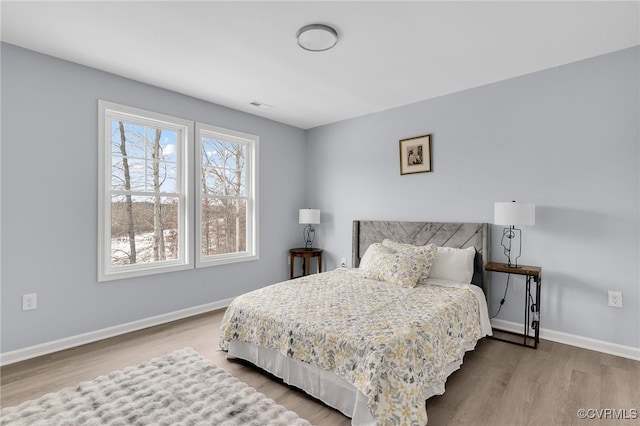 bedroom featuring wood-type flooring